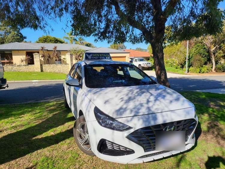 The white Dovetail Driving car